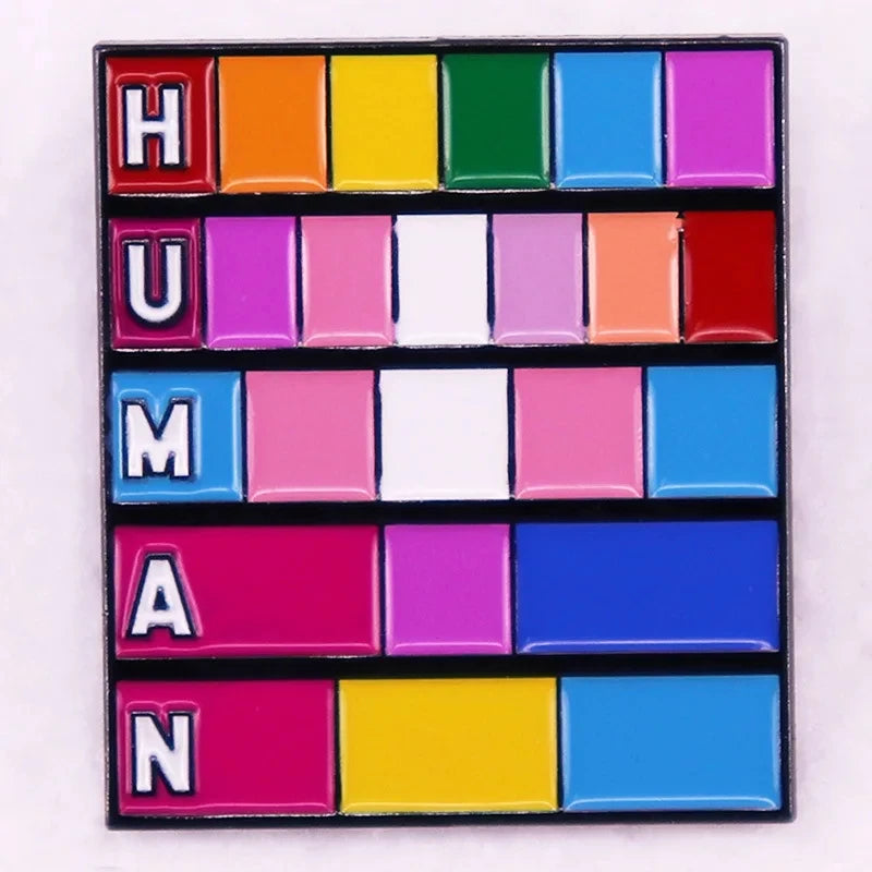 Pin's emaille HUMAN sur une mosaique de drapeaux LGBT