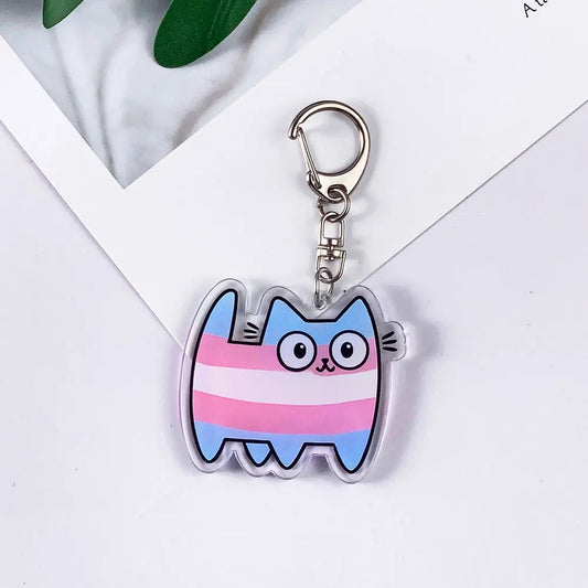 Porte-clés chat aux bandes bleu ciel, rose et blanc du drapeau transgenre, acrylique brillant et mousqueton argenté